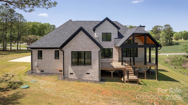rear view of property featuring roof with shingles, stairway, crawl space, brick siding, and a yard