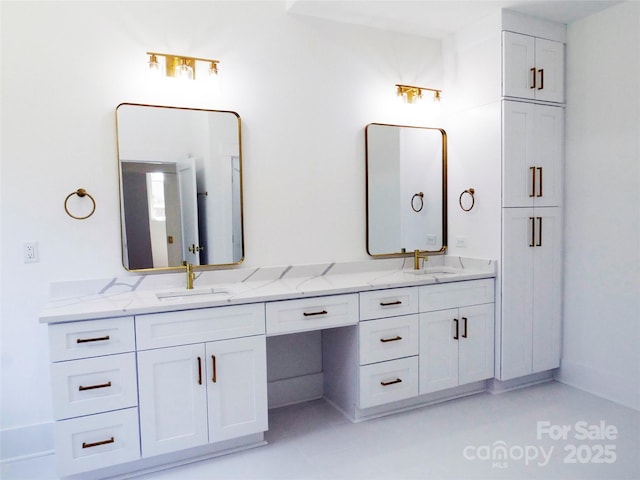bathroom with double vanity and a sink