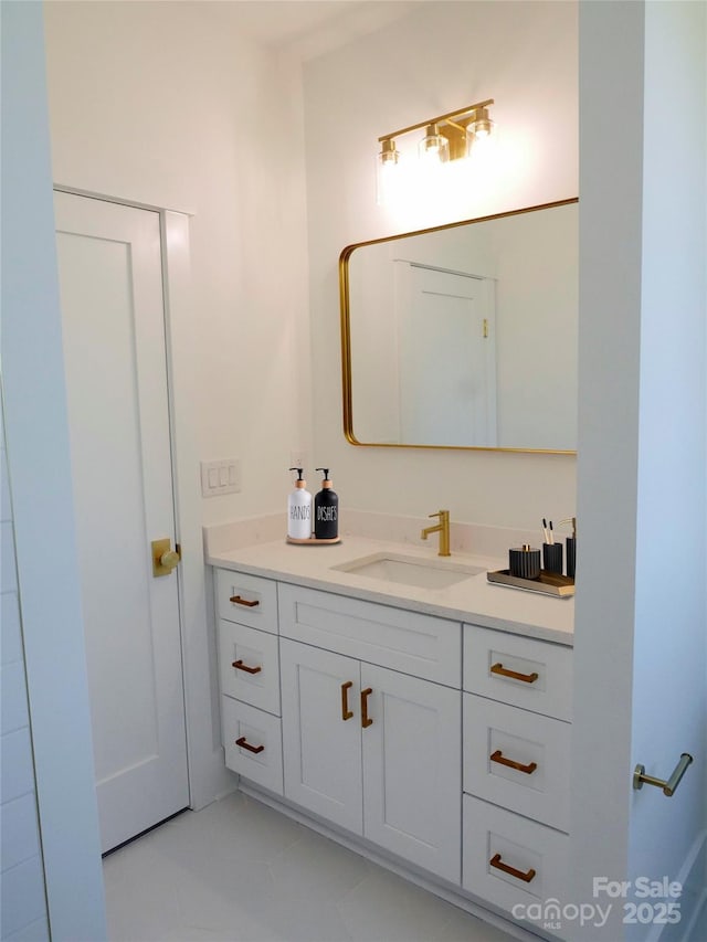 bathroom with tile patterned floors and vanity