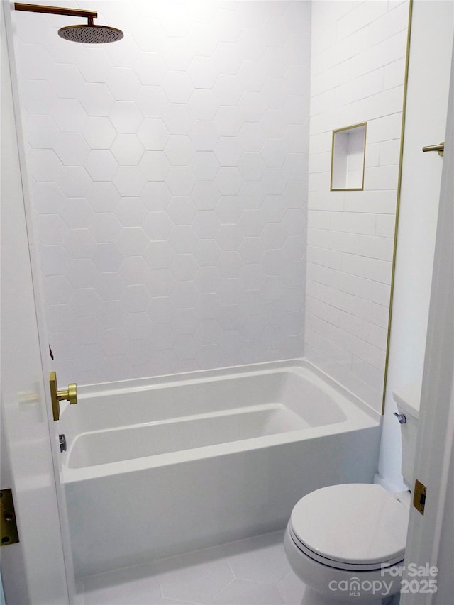 full bathroom featuring toilet, tile patterned floors, and bathtub / shower combination