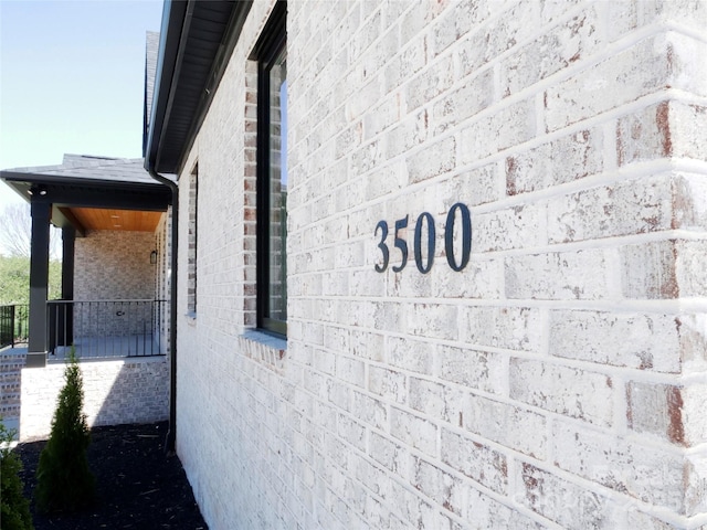view of property exterior featuring brick siding