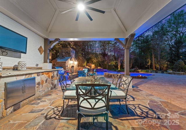 200 Highland Forest Dr, Charlotte, NC 28270 - view of patio with exterior kitchen, ceiling fan, outdoor dining space, an outdoor pool, and a gazebo