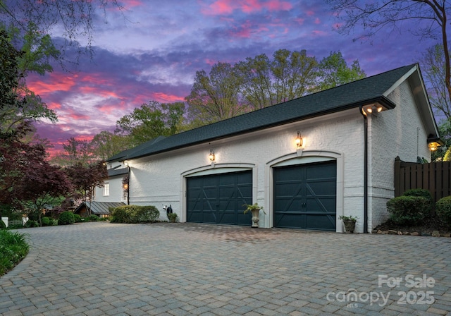 200 Highland Forest Dr, Charlotte, NC 28270 - property exterior at dusk featuring a garage and decorative driveway