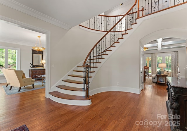 200 Highland Forest Dr, Charlotte, NC 28270 - staircase with arched walkways, plenty of natural light, wood finished floors, ornamental molding, and baseboards