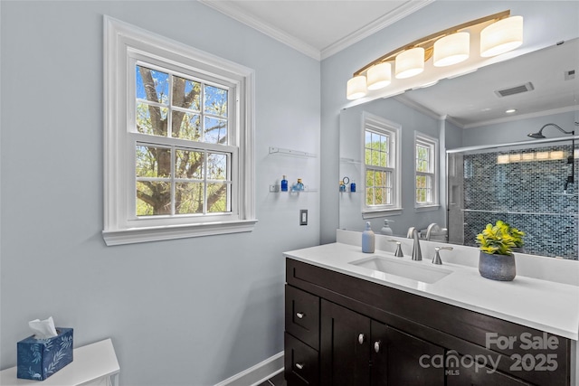 full bathroom with plenty of natural light, a shower stall, crown molding, and visible vents