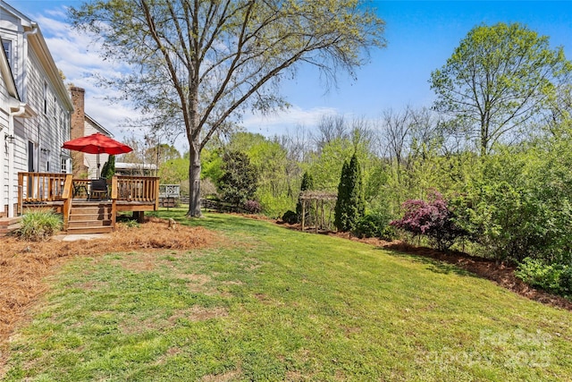view of yard with a deck