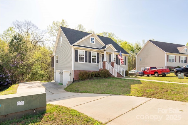 view of front of property featuring brick siding, a front yard, driveway, and an attached garage
