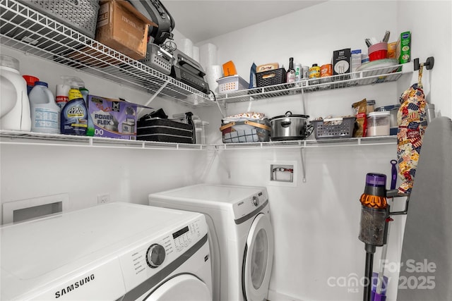 washroom with separate washer and dryer and laundry area