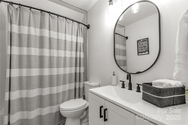 full bath featuring toilet and vanity