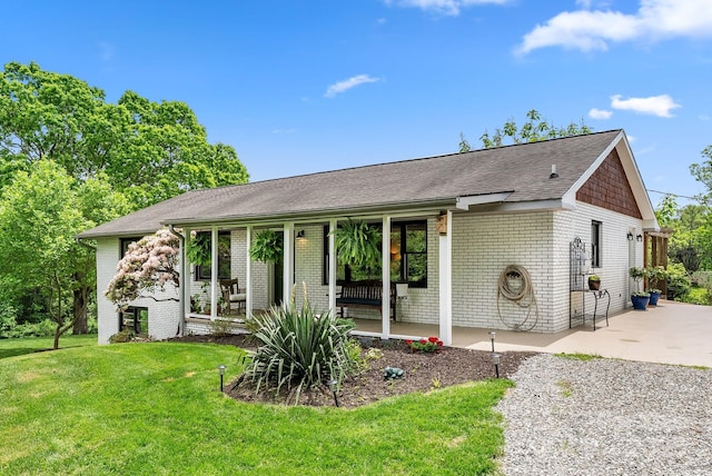 9 Mikayla Ln, Candler, NC 28715 - single story home featuring a front lawn, brick siding, and roof with shingles