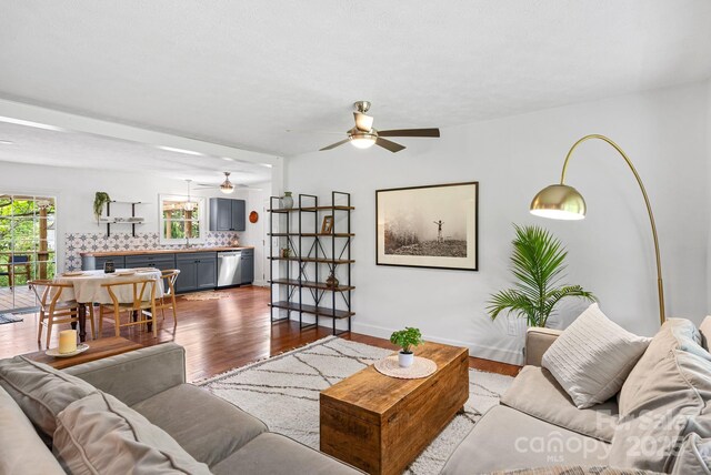 9 Mikayla Ln, Candler, NC 28715 - living area featuring ceiling fan, dark wood finished floors, and baseboards