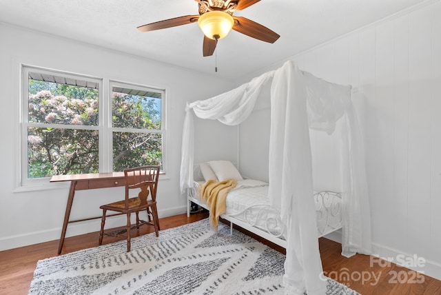 9 Mikayla Ln, Candler, NC 28715 - bedroom with multiple windows, wood finished floors, baseboards, and a ceiling fan
