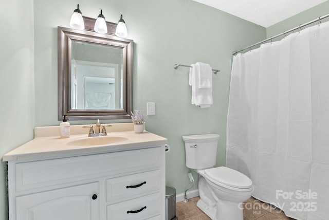 9 Mikayla Ln, Candler, NC 28715 - bathroom featuring tile patterned floors, toilet, vanity, and baseboards