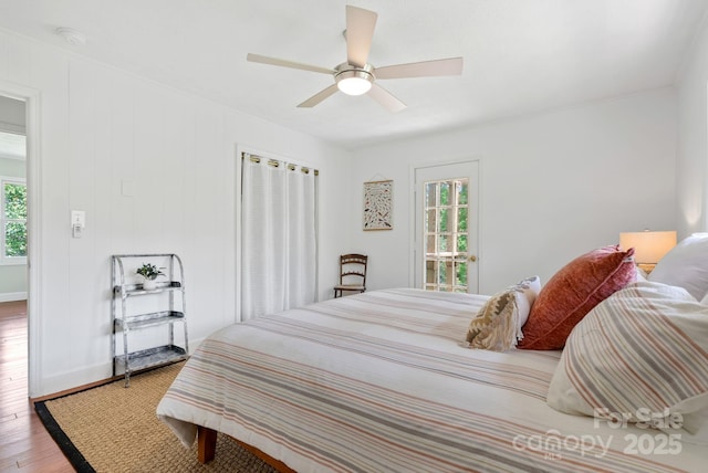 9 Mikayla Ln, Candler, NC 28715 - bedroom featuring multiple windows, wood finished floors, a ceiling fan, and baseboards