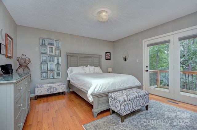 80 Vance Gap Rd, Asheville, NC 28805 - bedroom featuring access to outside, visible vents, and light wood-style floors