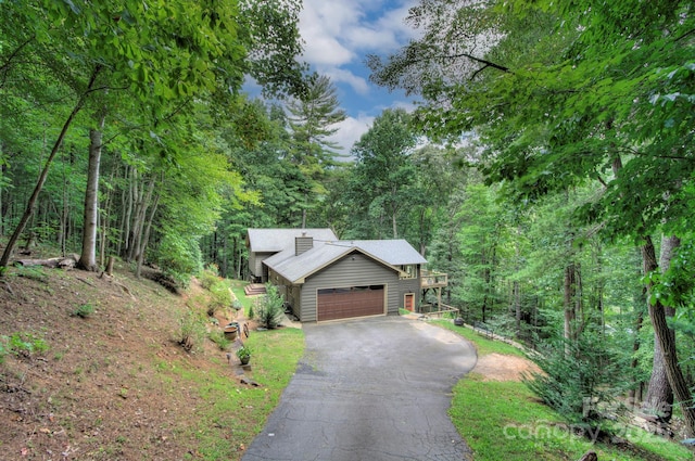 80 Vance Gap Rd, Asheville, NC 28805 - rustic home featuring a wooded view, driveway, and a garage