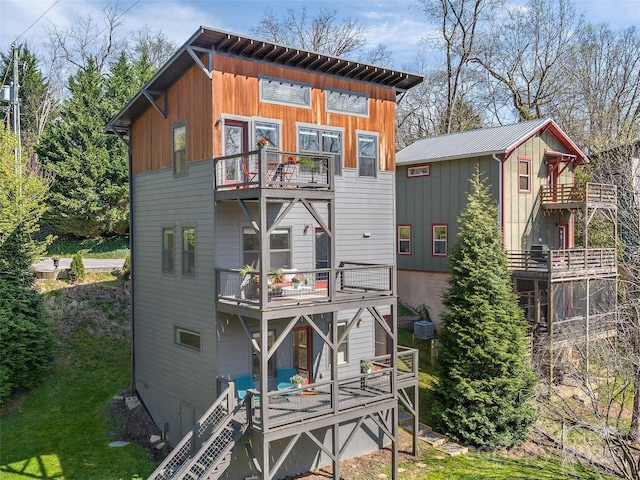 back of property featuring a balcony