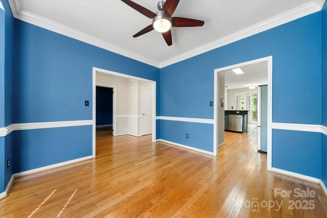 empty room featuring baseboards, ceiling fan, and wood-type flooring