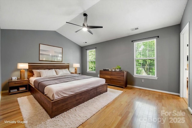 bedroom featuring multiple windows, visible vents, and light wood-style flooring