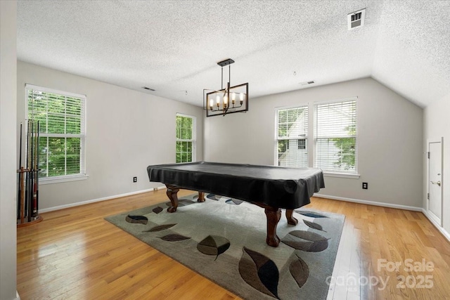 rec room with a textured ceiling, visible vents, light wood finished floors, and pool table
