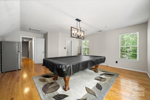 game room with a textured ceiling, baseboards, visible vents, light wood-style floors, and billiards