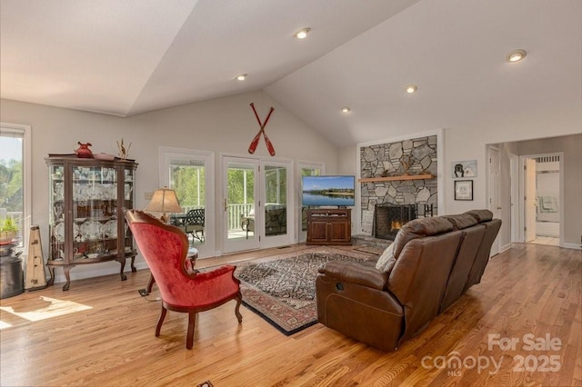 56 Lake Mist Ct Unit 30 & 30A, Nebo, NC 28761 - living area featuring high vaulted ceiling, a fireplace, and wood finished floors
