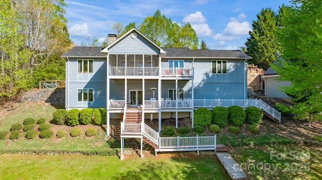 56 Lake Mist Ct Unit 30 & 30A, Nebo, NC 28761 - rear view of property featuring stairway, a sunroom, a lawn, and a chimney