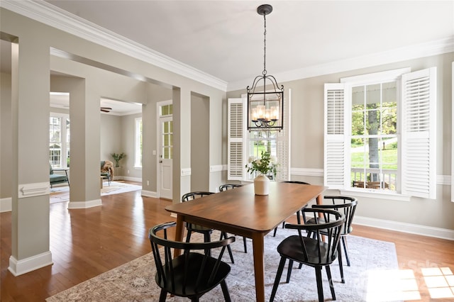 dining area with light wood-style floors, a chandelier, and plenty of natural light