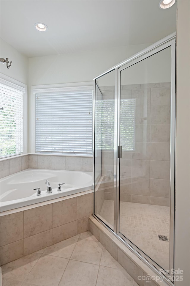 bathroom featuring recessed lighting, a shower stall, a bath, and tile patterned flooring