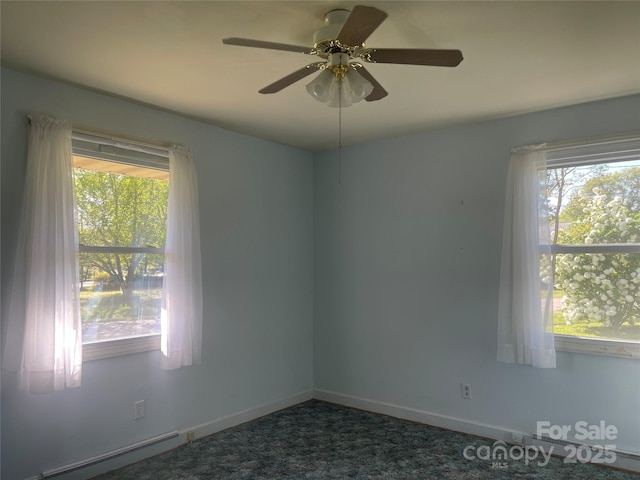 unfurnished room with a baseboard radiator, ceiling fan, and baseboards