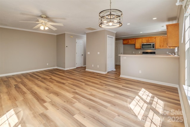 unfurnished living room featuring ornamental molding, baseboards, recessed lighting, light wood finished floors, and ceiling fan with notable chandelier