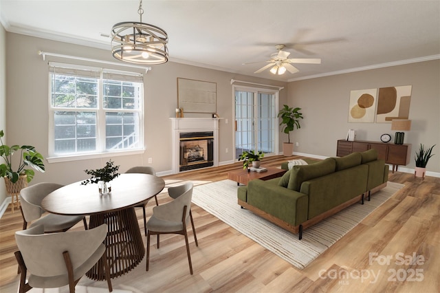 9 Willoughby Run Dr, Asheville, NC 28803 - living area with light wood-type flooring, baseboards, a fireplace, ceiling fan, and crown molding