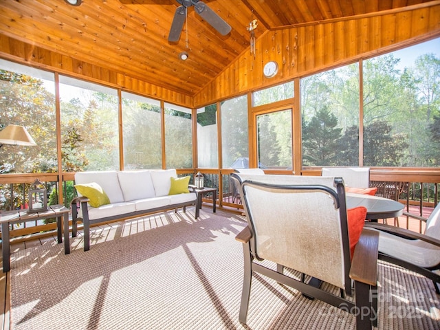 sunroom featuring outdoor dining space, an outdoor living space, a wealth of natural light, and ceiling fan