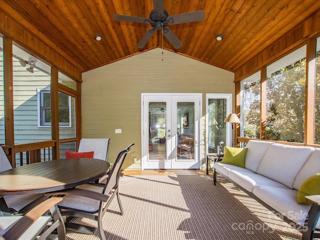 sunroom featuring outdoor dining area, french doors, a ceiling fan, and outdoor lounge area