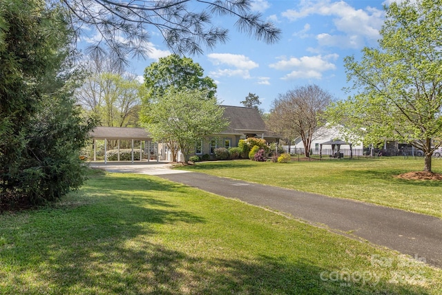 7900 Gilead Rd, Huntersville, NC 28078 - view of front of house featuring driveway and a carport