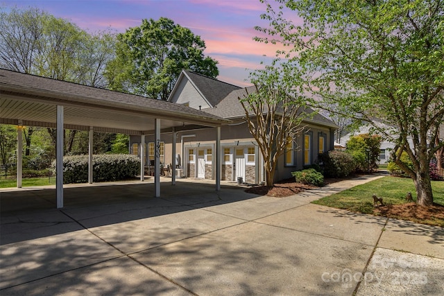 7900 Gilead Rd, Huntersville, NC 28078 - view of front of property with driveway, a shingled roof, a carport, and stucco siding