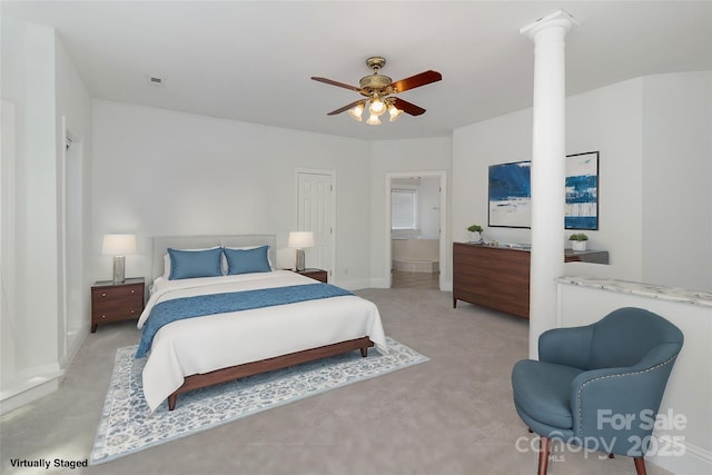7900 Gilead Rd, Huntersville, NC 28078 - carpeted bedroom with decorative columns, baseboards, ensuite bathroom, and a ceiling fan