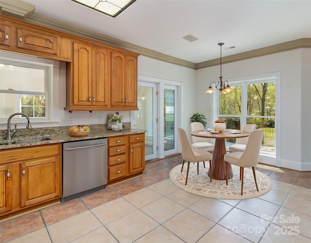 7900 Gilead Rd, Huntersville, NC 28078 - kitchen with stainless steel dishwasher, a sink, brown cabinetry, light stone counters, and decorative light fixtures