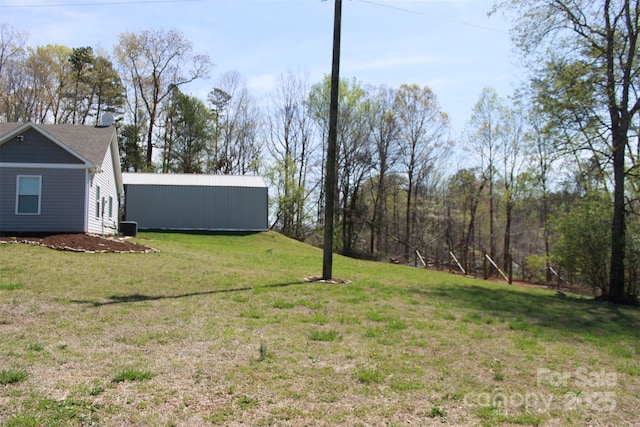 view of yard featuring an outbuilding and an outdoor structure
