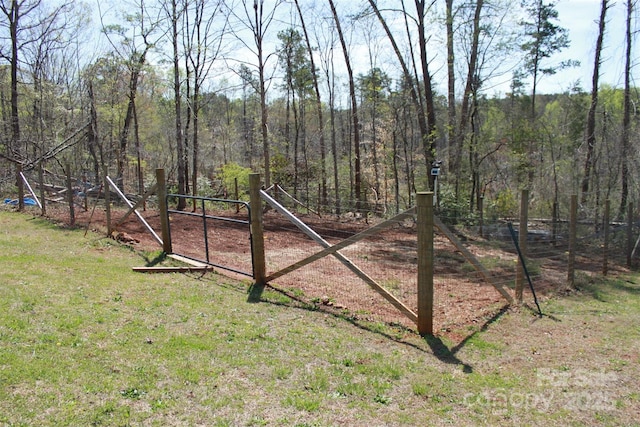 view of yard with a forest view