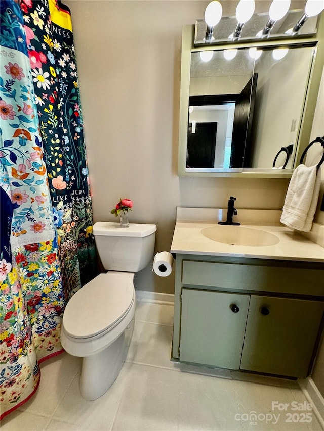 full bath with a shower with curtain, baseboards, toilet, tile patterned floors, and vanity