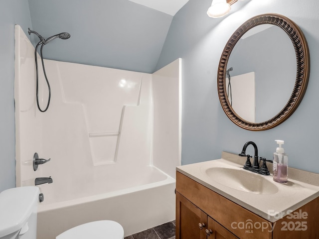 bathroom with lofted ceiling, shower / bathtub combination, vanity, and toilet