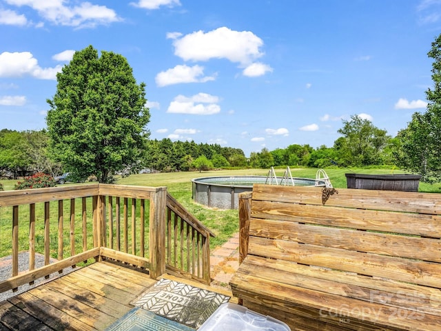 wooden terrace with a lawn and an outdoor pool