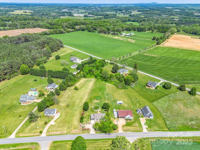 birds eye view of property featuring a rural view