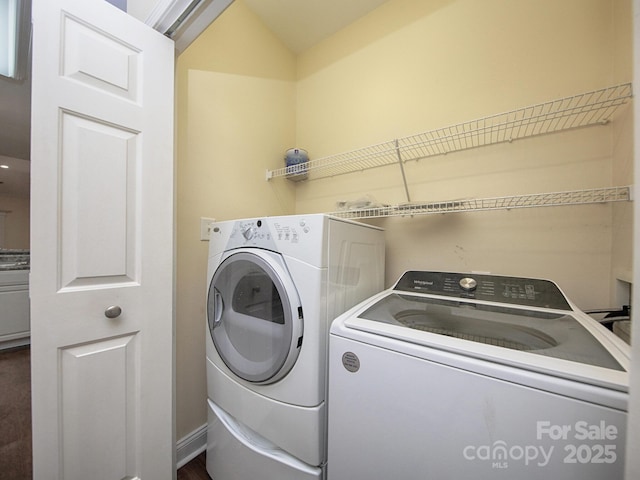 laundry area featuring washer and dryer and laundry area