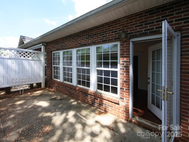 view of patio / terrace featuring fence