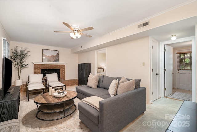 5329 Glenbrier Dr, Charlotte, NC 28212 - living area with ceiling fan, a fireplace, and ornamental molding