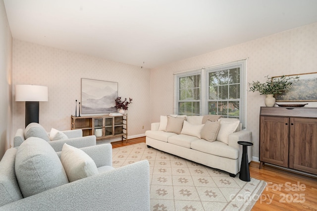 5329 Glenbrier Dr, Charlotte, NC 28212 - living room featuring wallpapered walls, light wood-type flooring, and baseboards