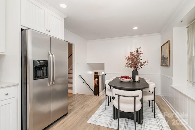 5329 Glenbrier Dr, Charlotte, NC 28212 - dining space with light wood-style flooring, crown molding, and recessed lighting