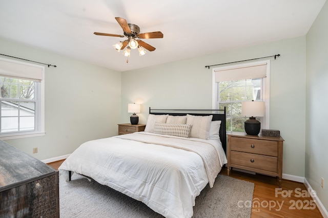 5329 Glenbrier Dr, Charlotte, NC 28212 - bedroom with wood finished floors, baseboards, and a ceiling fan